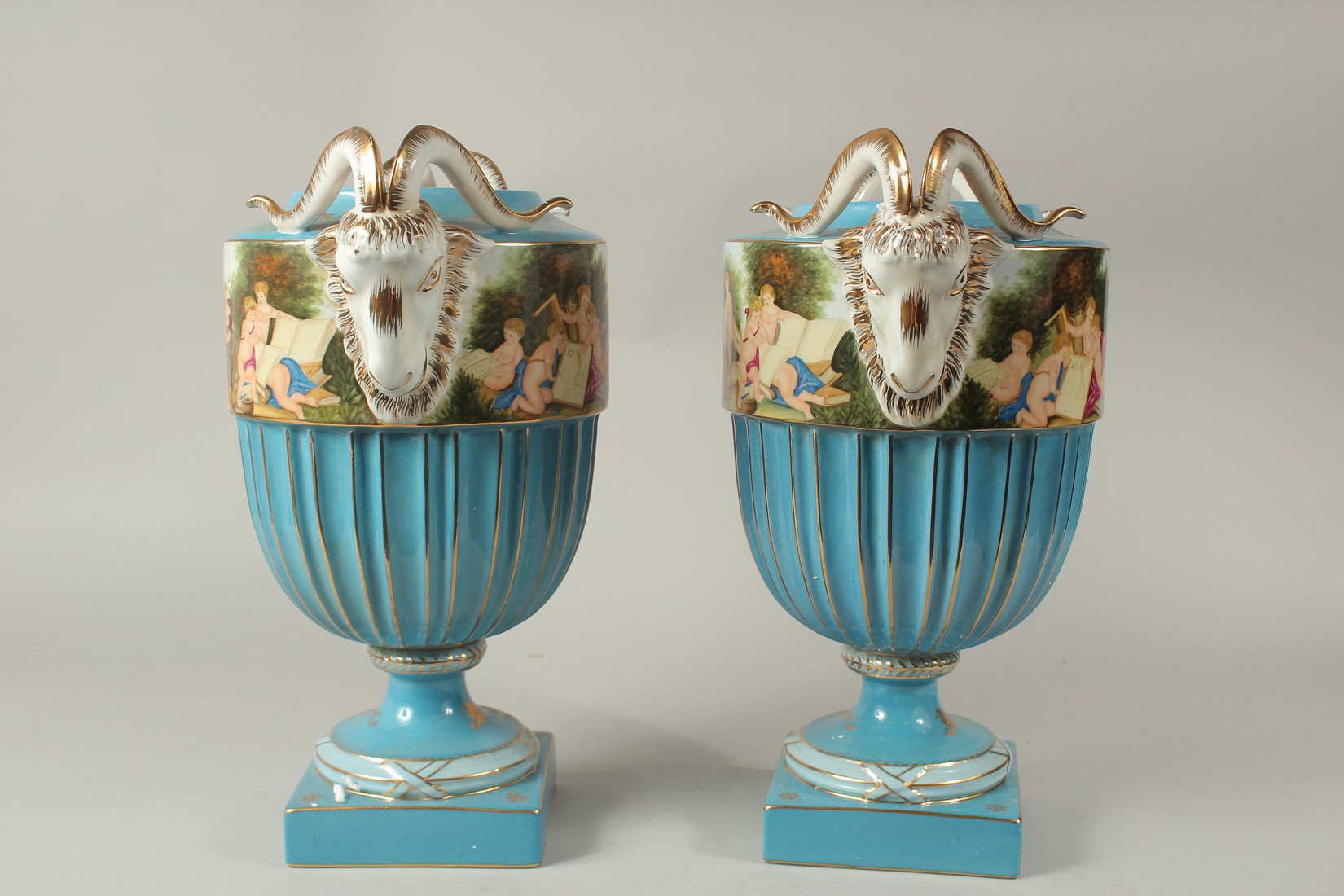 A LARGE PAIR OF SEVRES DESIGN CIRCULAR RAM'S HEAD BLUE VASES. 40cms high. - Image 2 of 3