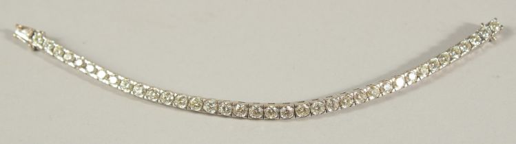 A GOOD 18CT WHITE GOLD DIAMOND LINE BRACELET, approx. 10ct of diamonds.