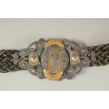 AN UNUSUAL FRENCH / MIDDLE EASTERN STYLE BELT WITH MIXED METAL BUCKLE.