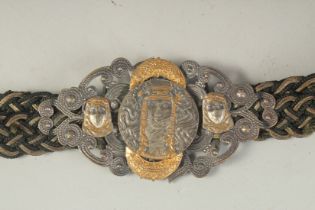 AN UNUSUAL FRENCH / MIDDLE EASTERN STYLE BELT WITH MIXED METAL BUCKLE.