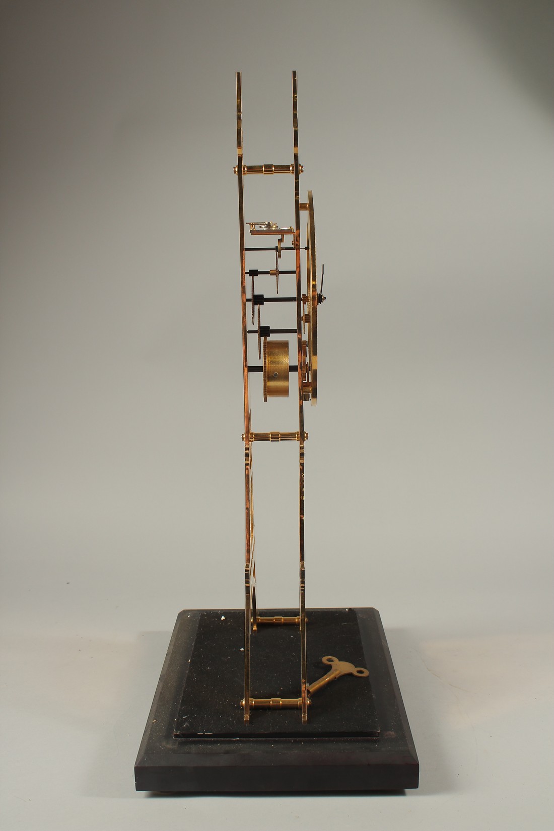 AN EIFFEL TOWER BRASS SKELETON CLOCK in a glass case. 56cms high. - Image 3 of 4