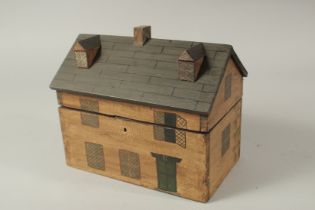 A WOODEN REPLICA HOUSE TEA CADDY. 24cms long.