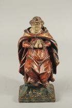 A FINE 17TH - 18TH CENTURY CARVING, A MAN PRAYING. 15ins high.