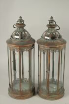 A PAIR OF COPPER LANTERNS. 55cms high.