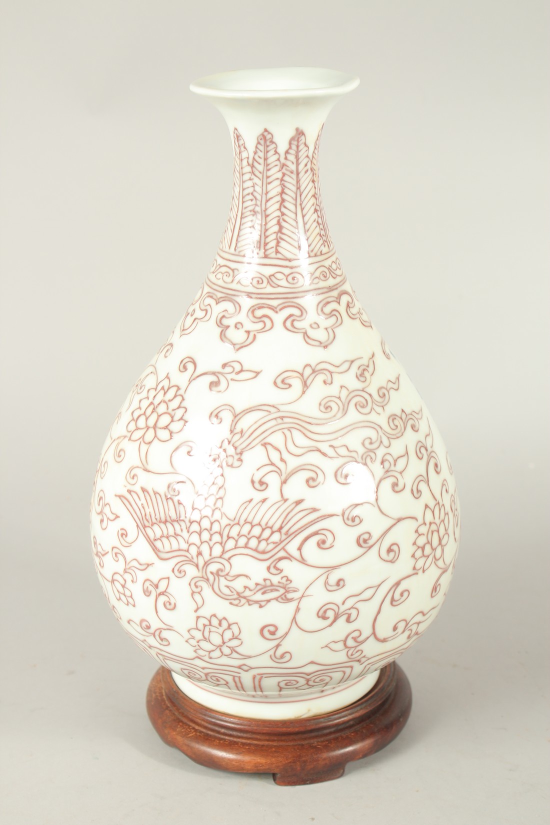 A CHINESE UNDERGLAZE RED AND WHITE YUHUCHUNPIN VASE and wood stand. Vase 30cms high. - Image 2 of 4