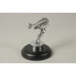 A SPIRIT OF ECSTASY CAR MASCOT on a circular base. 11cms high.