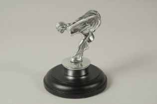 A SPIRIT OF ECSTASY CAR MASCOT on a circular base. 11cms high.