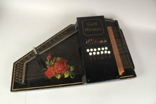 A B & M MIRANDA AUTO HARP, painted with roses. 23ins long.