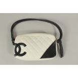 A CHANEL WHITE LEATHER BAG with black CC and handle, with dust cover. 22cms long x 15cms deep.