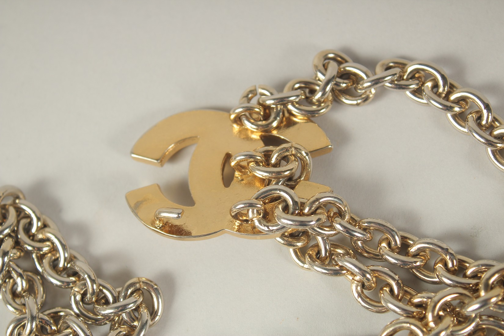 A LONG CHANEL GILT BELT with pendant and tie, double C emblem. 110cms long. - Image 6 of 9