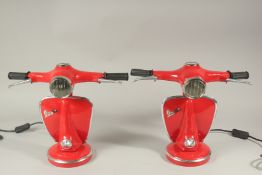 A PAIR OF RED VESPA LAMPS.