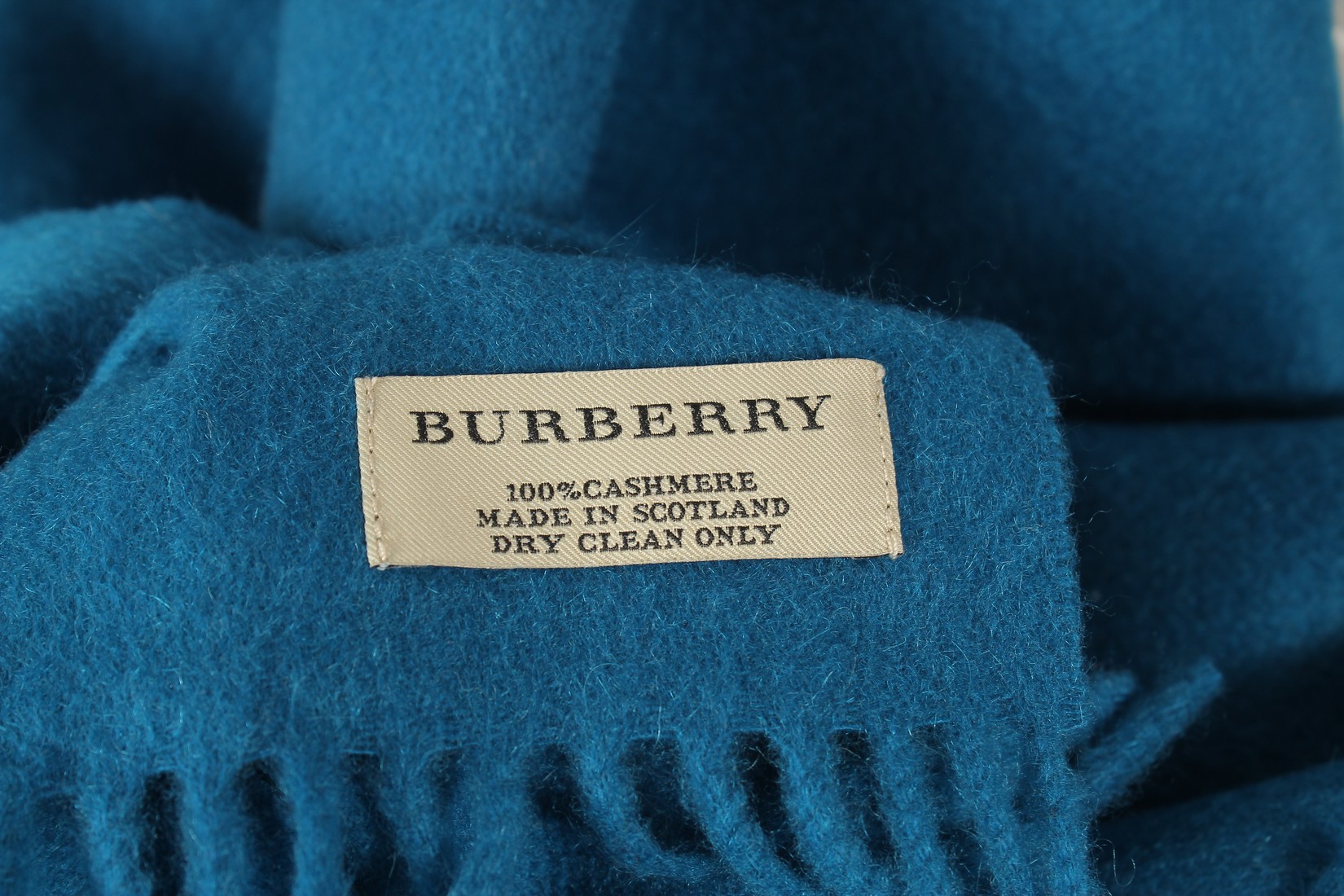 A BURBERRY BLUE WOOL SCARF. 200cms long. - Image 3 of 3