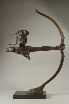 A LARGE ABSTRACT BRONZE INDIAN ARCHER on a marble base. 70cms high.