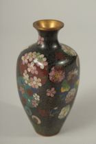 A CLOISONNE VASE with flowers. 12cms high.