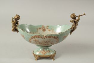 A SEVRES STYLE PORCELAIN AND GILT METAL OVAL COMPORT with cupid handles. 28cms long.