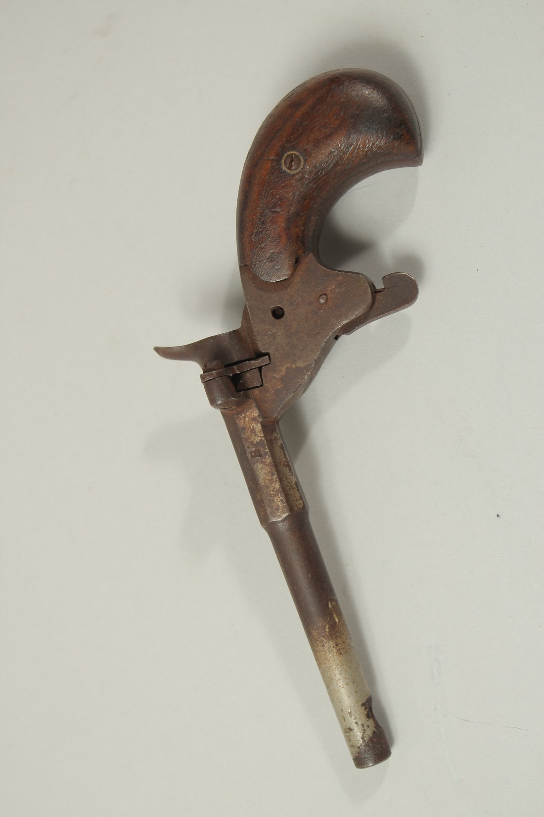 A SMALL PERCUSSION CAP GUN. 6ins long.