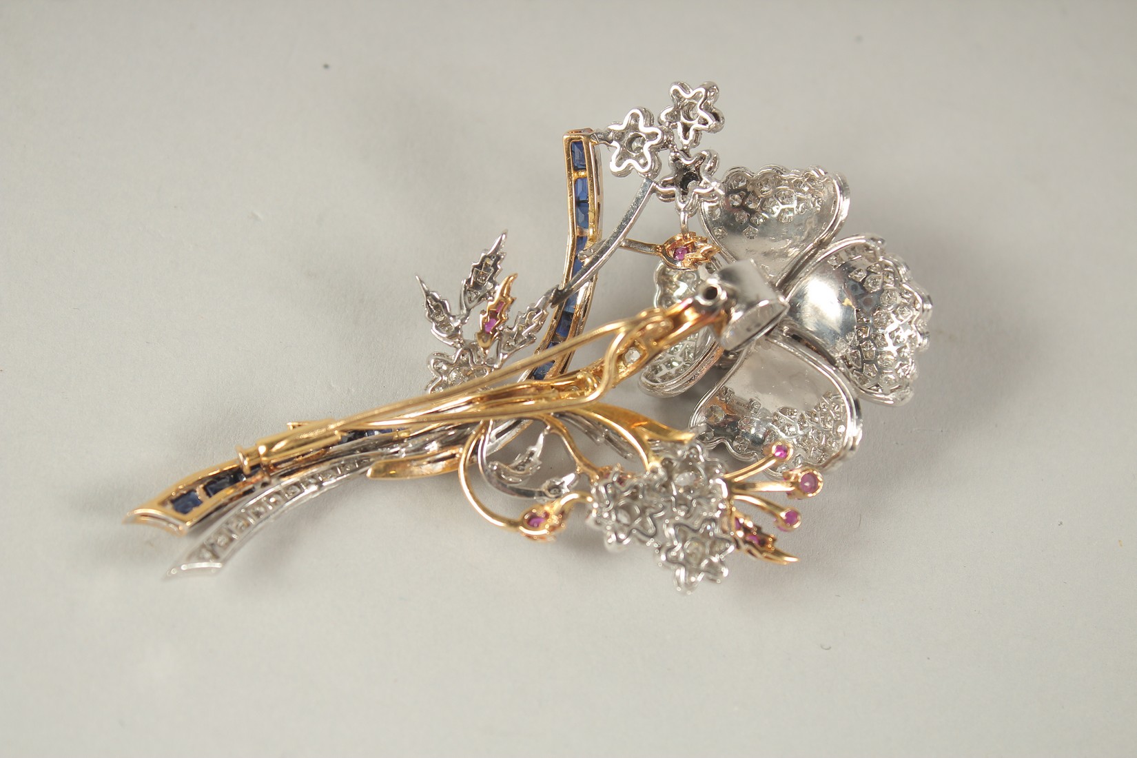 A SUPERB 18CT GOLD, DIAMOND, RUBY AND SAPPHIRE TREMBLING FLOWER BROOCH. 35grams. - Image 4 of 5