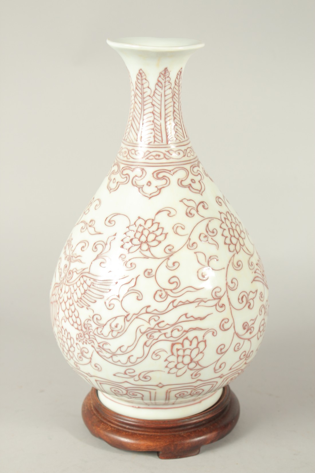 A CHINESE UNDERGLAZE RED AND WHITE YUHUCHUNPIN VASE and wood stand. Vase 30cms high. - Image 3 of 4