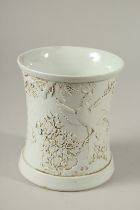A GOOD CHINESE BLANC DE CHINE CIRCULAR BRUSH POT with birds and foliage in relief.