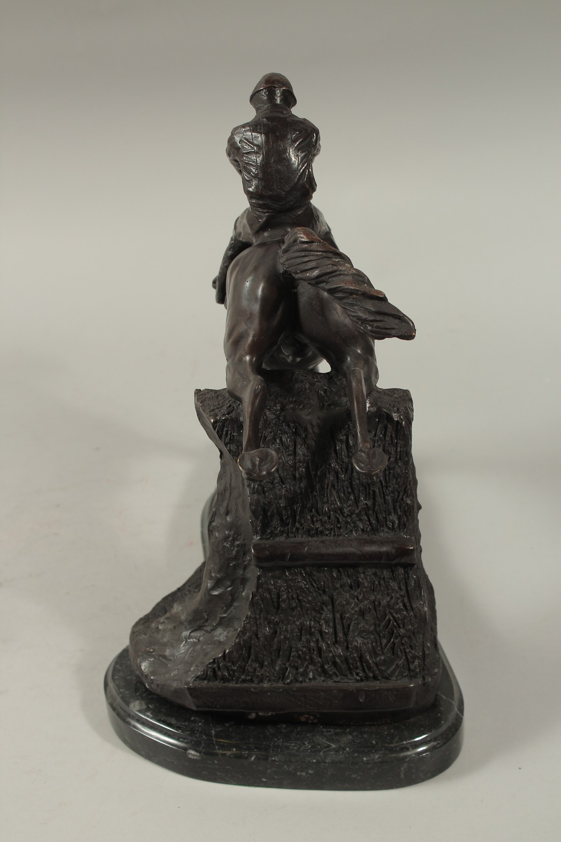 A FINE BRONZE GROUP, HORSE AND JOCKEY OVER THE FENCE, on a marble base. 12ins high. - Image 6 of 6