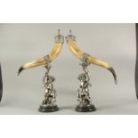 A SUPERB LARGE PAIR OF MOUNTED HORN AND PLATE TABLE CENTREPIECES, the horns 22ins long with fruiting