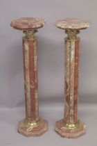 A PAIR OF RED MARBLE CLUSTER COLUMNS with gilt metal mounts. 3ft 4ins high.