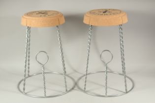 A PAIR OF CHAMPAGNE CORK STOOLS.