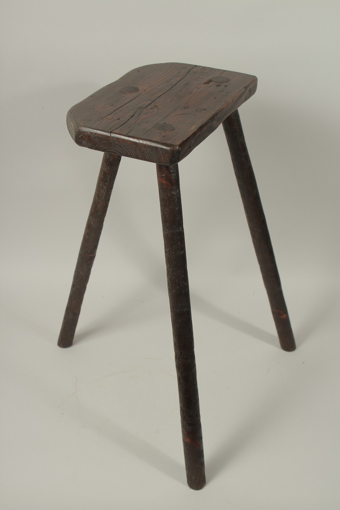 A CUTLER'S OF SHEFFIELD WOODEN STOOL. 2ft high.