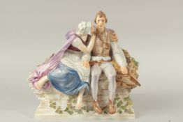 A MEISSEN GROUP OF TILL EULENSPIEGAL AND NELE. He is probably a fictional character from the 14th