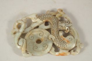 A CARVED JADE AMULET. 10cms x 8cms.