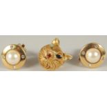 A PAIR OF CHRISTIAN DIOR GILT METAL AND PEARL EAR CLIPS and a CAT BROOCH.