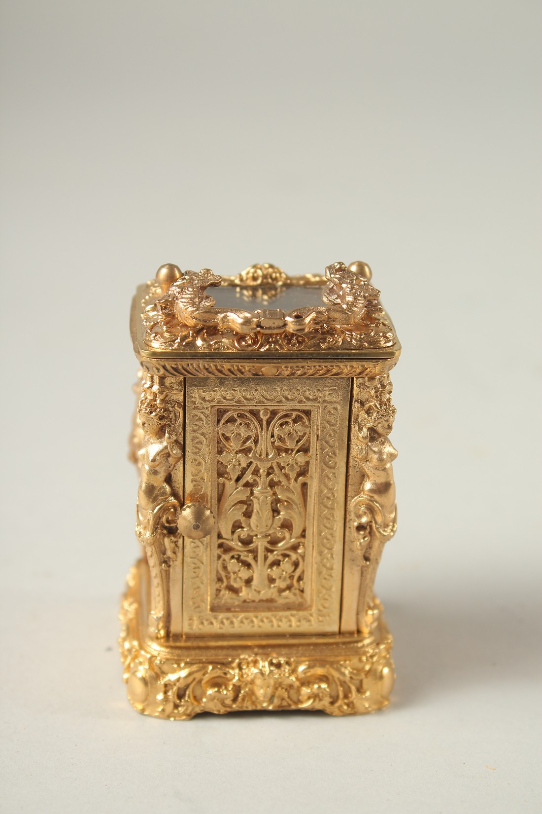 A CAST GILT MINIATURE CARRIAGE CLOCK with female figures. - Image 3 of 5
