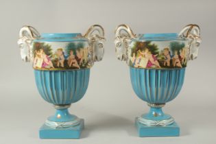 A LARGE PAIR OF SEVRES DESIGN CIRCULAR RAM'S HEAD BLUE VASES. 40cms high.