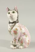 EMILE GALLE. A SUPERB SEATED PORCELAIN CAT decorated with bunches of flowers. 32cms high.