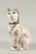 EMILE GALLE. A SUPERB SEATED PORCELAIN CAT decorated with bunches of flowers. 32cms high.