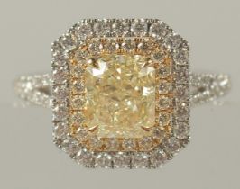 A SUPERB 18CT WHITE GOLD 2 CT NATURAL YELLOW DIAMOND AND WHITE DIAMOND CLUSTER RING. Clarity VVS2.