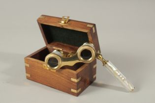 A PAIR OF MOTHER-OF-PEARL OPERA GLASSES in a box.