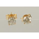 A PAIR OF 18CT YELLOW GOLD FOUR CLAW RBC DIAMOND SOLITAIRE STUDS. Diamonds 0.96ct.