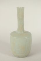 A CHINESE CELADON GLAZE VASE, with carved deer and flora. 29cms high.