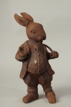 A CAST IRON BEATRIX POTTER RABBIT. 45cms high.