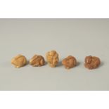 FIVE VARIOUS CARVED NUT NETSUKES. Four monkeys and a figure.
