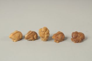 FIVE VARIOUS CARVED NUT NETSUKES. Four monkeys and a figure.
