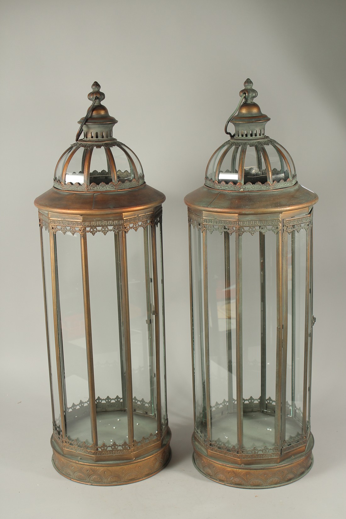 A LARGE PAIR OF COPPER LANTERNS. 85cms high.