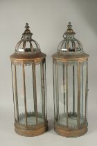 A LARGE PAIR OF COPPER LANTERNS. 85cms high.