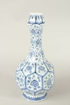 A CHINESE BLUE AND WHITE GARLIC HEAD OCTAGONAL VASE, with floral panels. 35cms high.