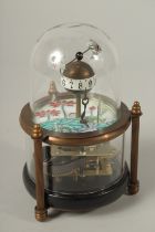 A SMALL AMUSING FISH CLOCK with glass dome. 14cms high.