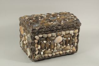 A 19TH CENTURY SHELL COVERED DOMED BOX, the interior with parchment. 16ins long x 11ins high x 10.