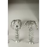 A PAIR OF SILVER PLATE PALM TREE LAMPS. 70cms high.