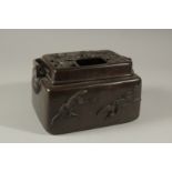 A GOOD CHINESE BRONZE SILVER INLAID CENSER with carrying handle and birds in relief. 18cms long.