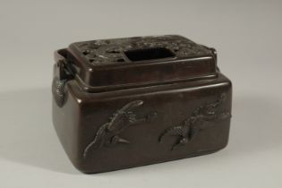 A GOOD CHINESE BRONZE SILVER INLAID CENSER with carrying handle and birds in relief. 18cms long.